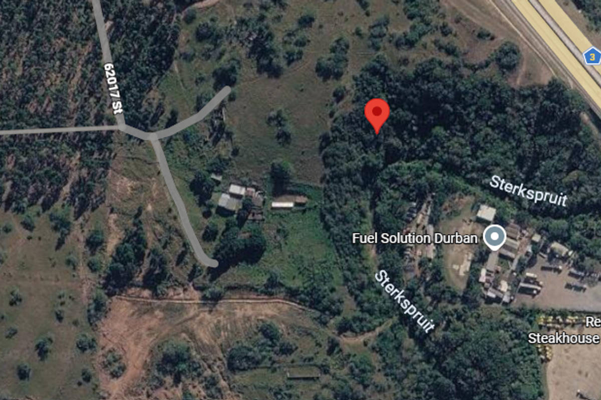 An aerial satellite view showing the residential land plot location in relation to surrounding roads and local infrastructure.