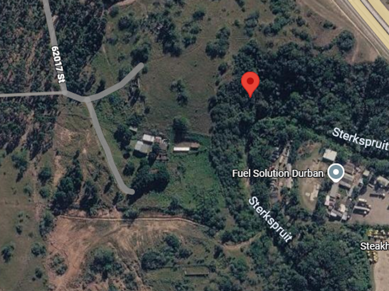 An aerial satellite view showing the residential land plot location in relation to surrounding roads and local infrastructure.