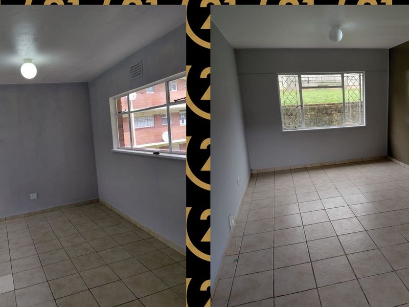 An empty bedroom featuring tiled flooring, a metal-framed window, and a simple ceiling light fixture.