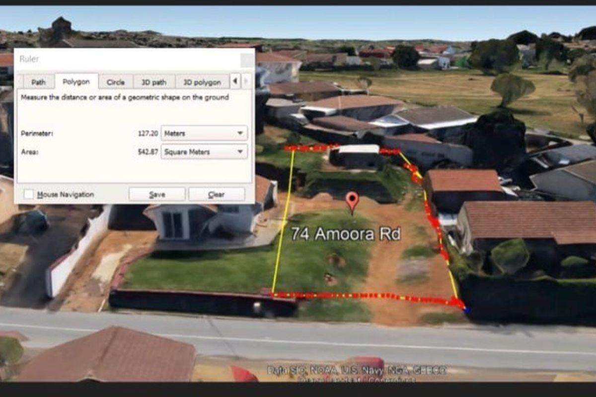 An aerial view of a vacant residential plot located at 74 Amoora Road, showing the property boundaries and surrounding neighborhood context.
