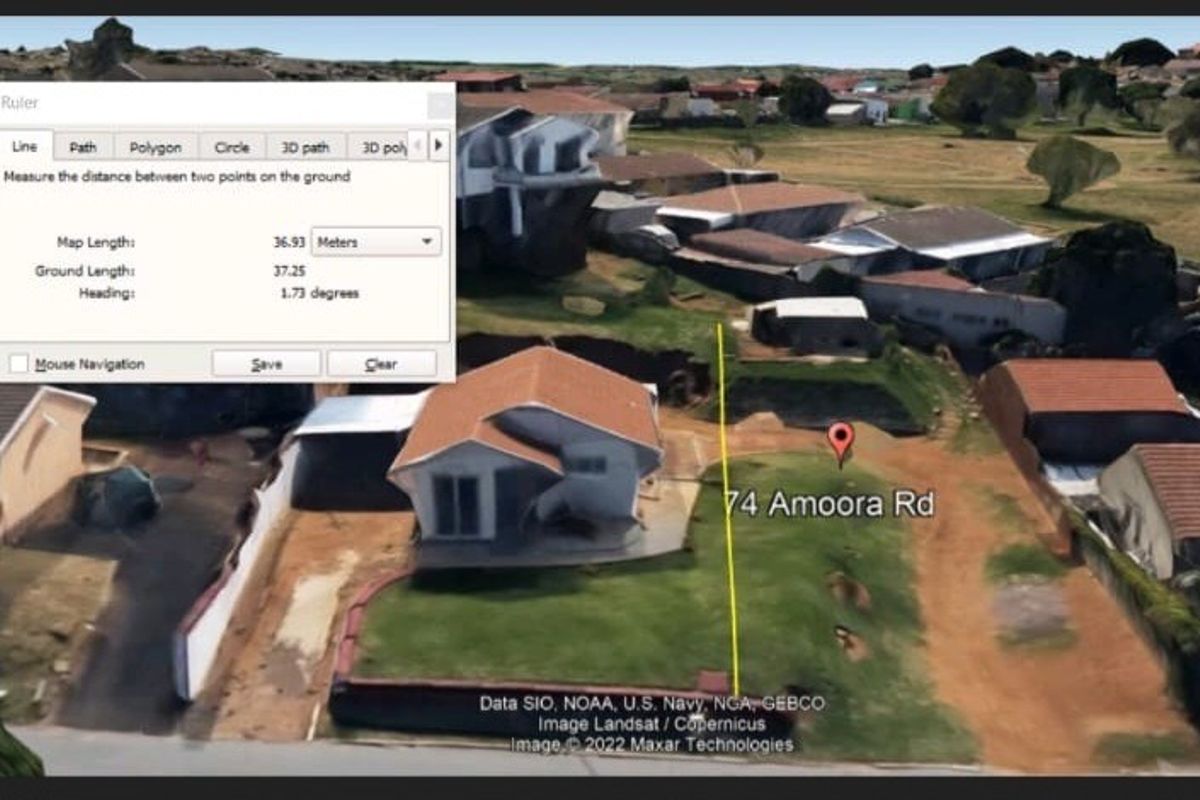 Aerial view of the residential vacant land plot showing property boundaries and surrounding neighborhood context.