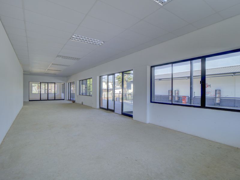 Corner shop with large patio - Photo 4