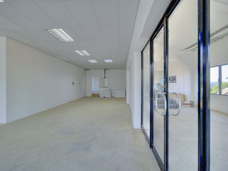 Corner shop with large patio - Photo 10