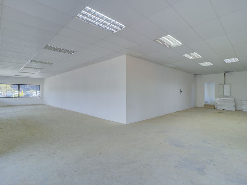 Corner shop with large patio - Photo 9