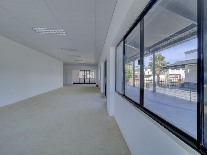 Corner shop with large patio - Photo 6