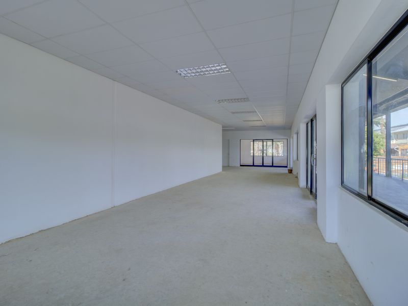 Corner shop with large patio - Photo 5