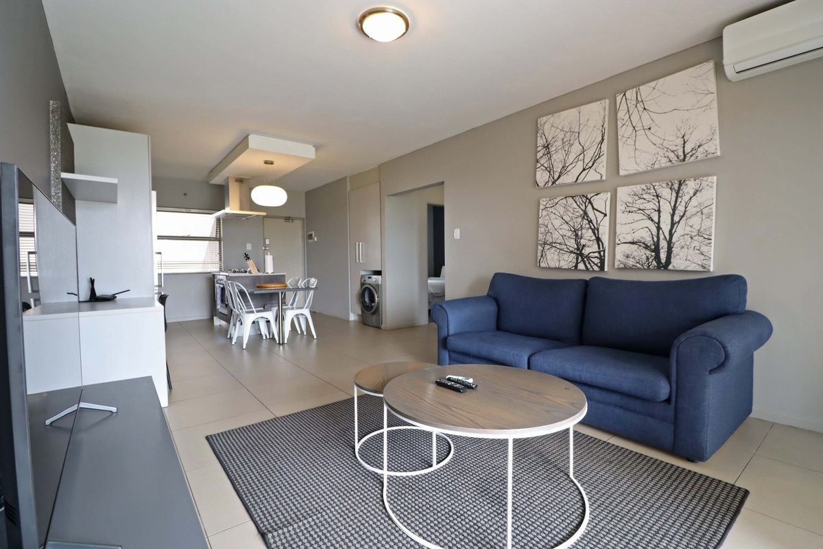 Secure & Stylish 2-Bedroom Apartment in Well Maintained Complex - Photo 2