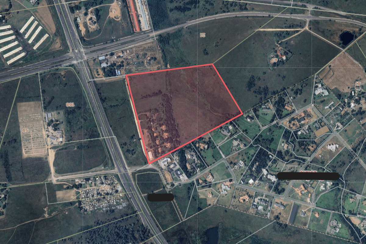 An aerial view showing the boundaries of the vacant residential land plot in relation to the surrounding area and road network.