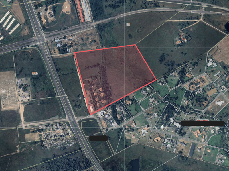 An aerial view showing the boundaries of the vacant residential land plot in relation to the surrounding area and road network.