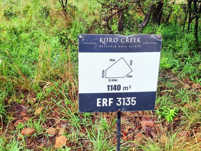 A property signage board displaying the dimensions and erf number for a 1140 square meter vacant residential stand in Koro Creek Bushveld Golf Estate.