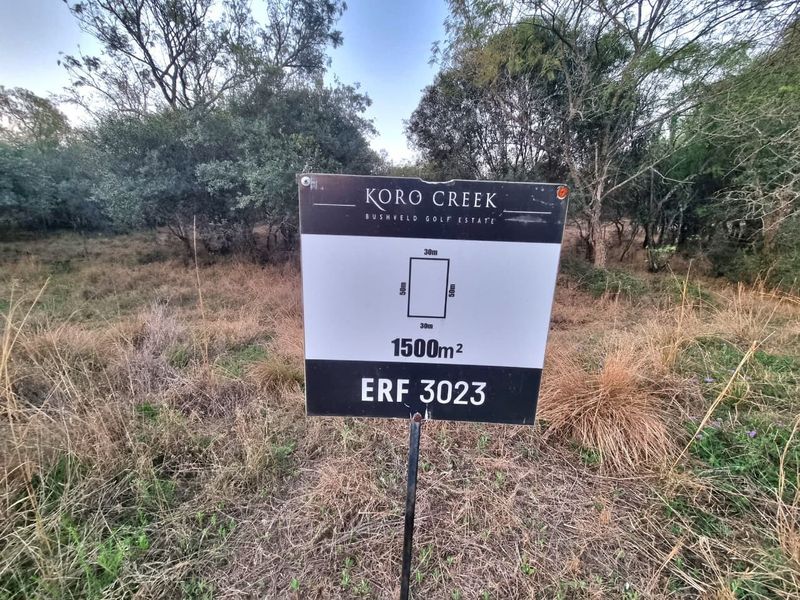 A vacant residential plot in Koro Creek Bushveld Golf Estate, measuring 1500 square meters, featuring natural bushveld vegetation.