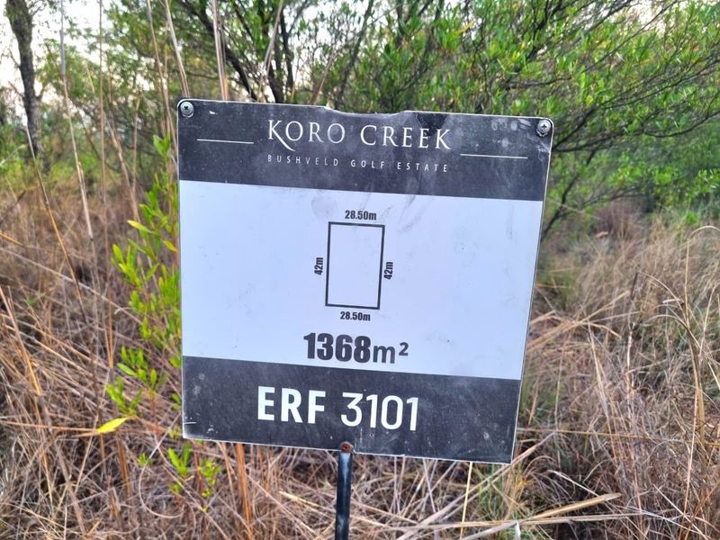 A clear property signage board for a 1368m2 residential erf located within the Koro Creek Bushveld Golf Estate.