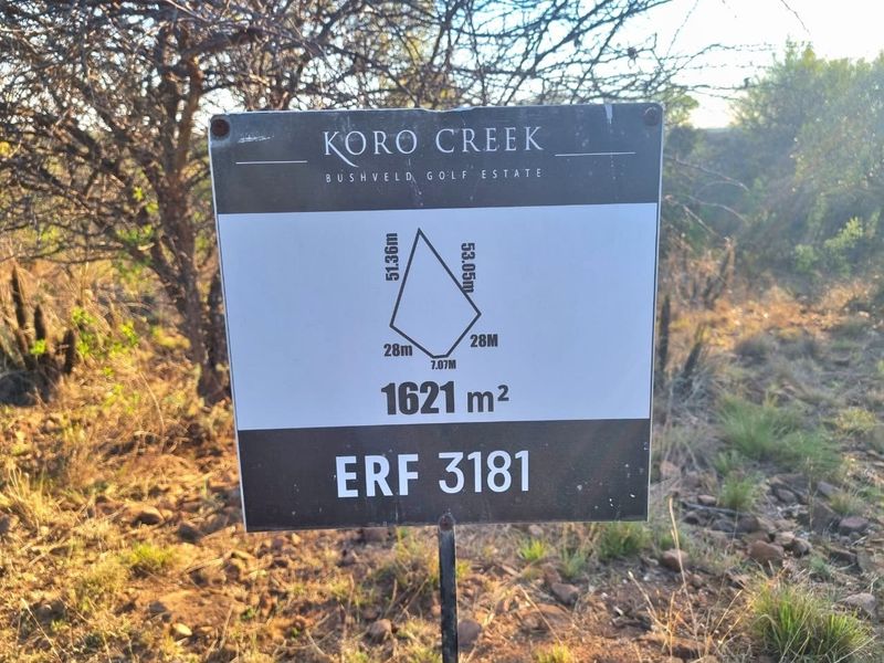 A clear signage board displaying the plot dimensions and area of 1621 square meters for Erf 3181 in Koro Creek Bushveld Golf Estate.
