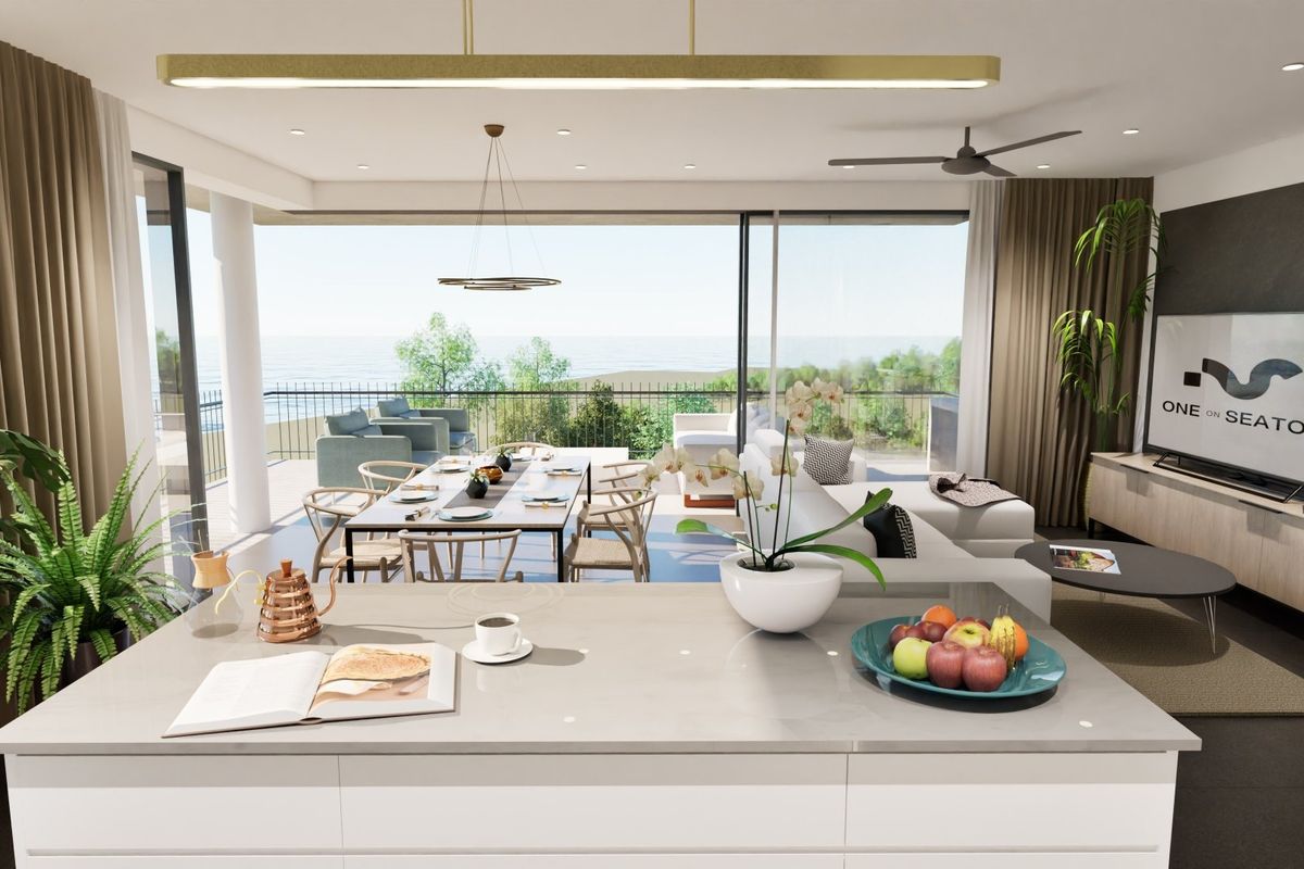 Modern open-plan living area featuring a sleek kitchen island, expansive sliding glass doors leading to a balcony, and integrated ceiling lighting.