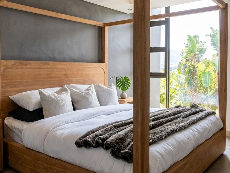 A modern, well-appointed bedroom featuring large windows with natural light, high-quality finishes, and a contemporary aesthetic.