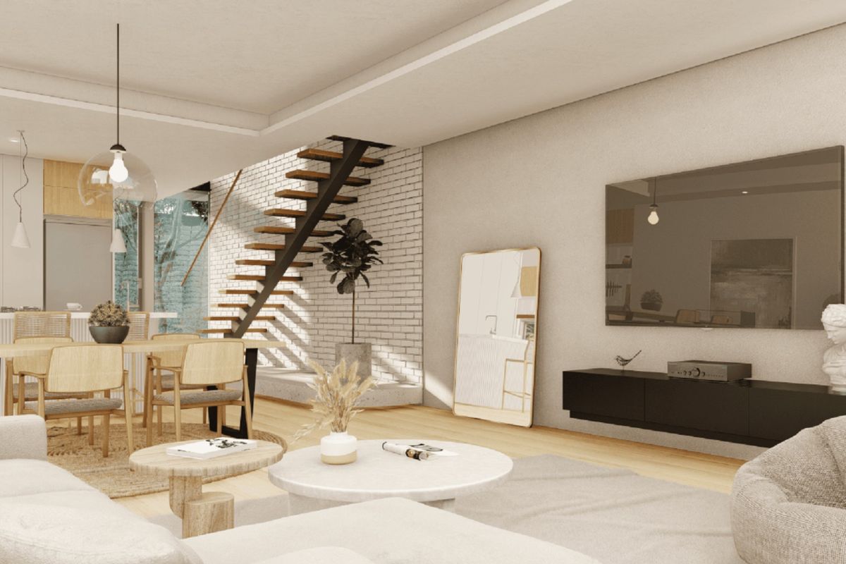 Modern open-plan living and dining area featuring a striking floating staircase, exposed brick wall, and sleek built-in media console with hardwood flooring.