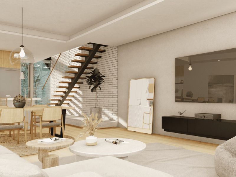 Modern open-plan living and dining area featuring a striking floating staircase, exposed brick wall, and sleek built-in media console with hardwood flooring.