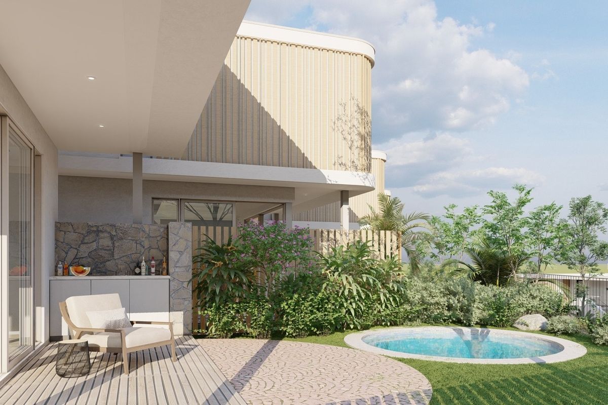 A modern covered patio featuring timber decking, built-in outdoor cabinetry with a stone feature wall, leading to a private plunge pool and landscaped garden.