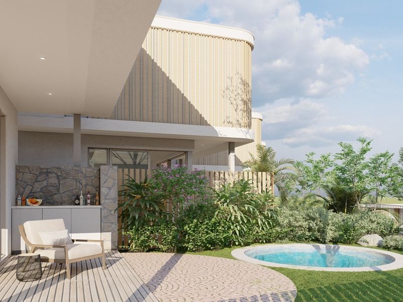 A modern covered patio featuring timber decking, built-in outdoor cabinetry with a stone feature wall, leading to a private plunge pool and landscaped garden.