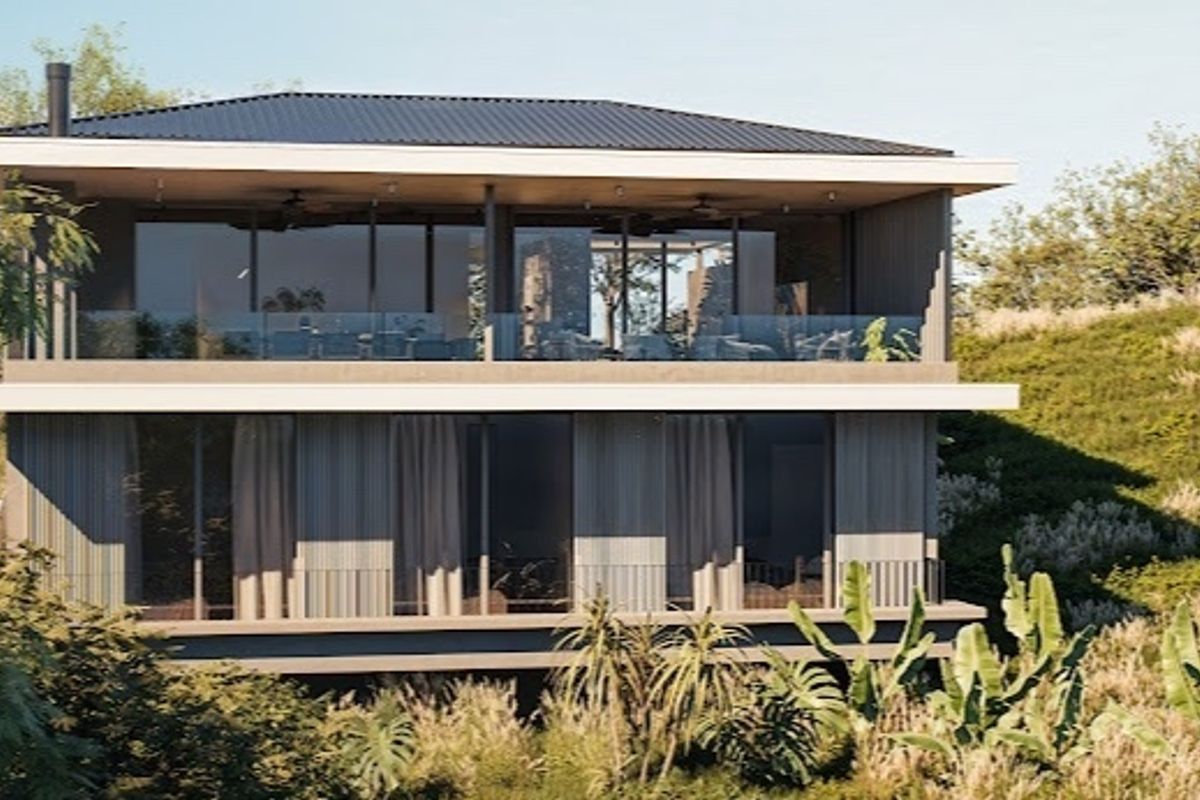 A modern two-story residential structure featuring expansive glass sliding doors, covered balconies with glass balustrades, and a sleek metal roof set in a natural landscape.