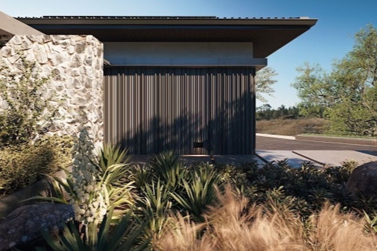 A modern residential exterior featuring stone cladding, vertical metal siding, and a deep roof overhang, set within a landscaped garden.