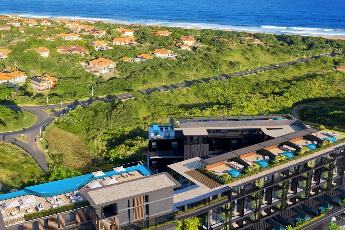 Aerial view of a modern penthouse complex featuring rooftop swimming pools, landscaped terraces, and proximity to the coastline.
