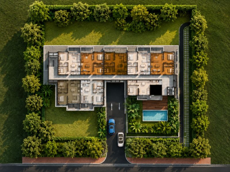 An aerial view of the apartment complex site plan, featuring a swimming pool, landscaped gardens, and dedicated parking access.