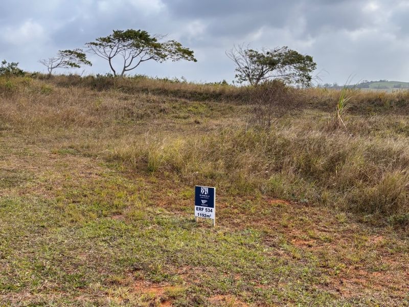 A vacant residential plot of land measuring 1192 square meters, featuring natural grassland and open terrain.