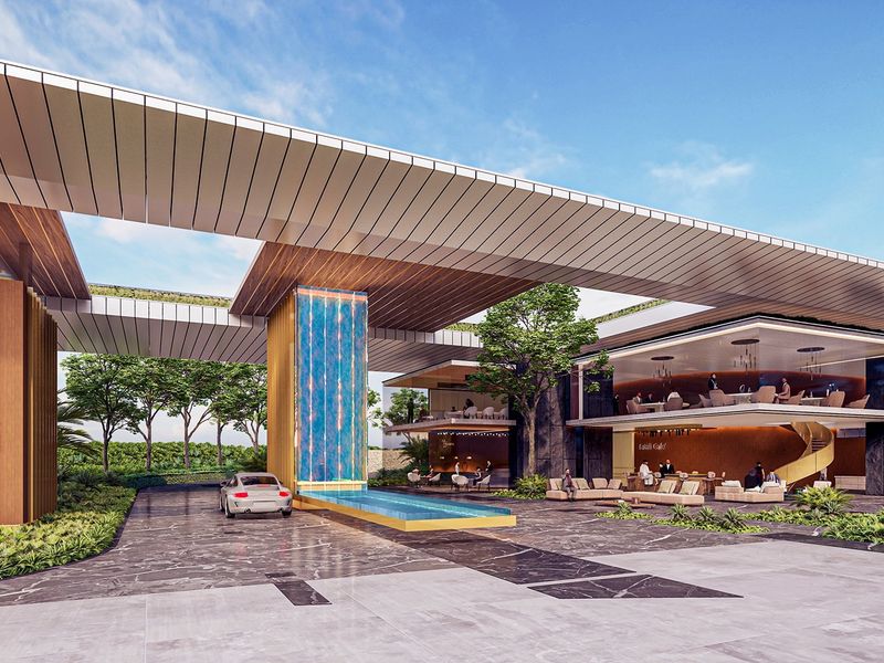 A modern architectural entrance featuring a large canopy, a central water feature, and landscaped surroundings at the Tatali Zimbali Lakes development.