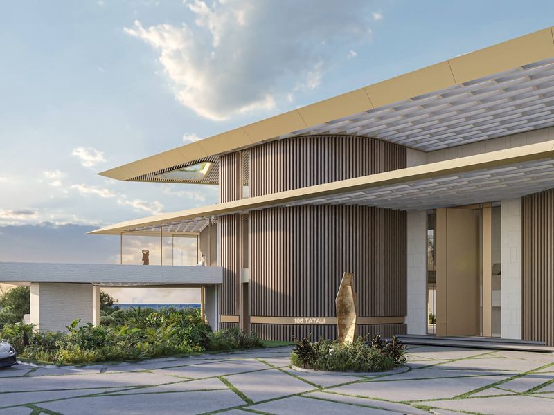 A modern architectural front elevation featuring a grand entrance, timber-clad cylindrical structure, and a paved driveway set within a landscaped garden.