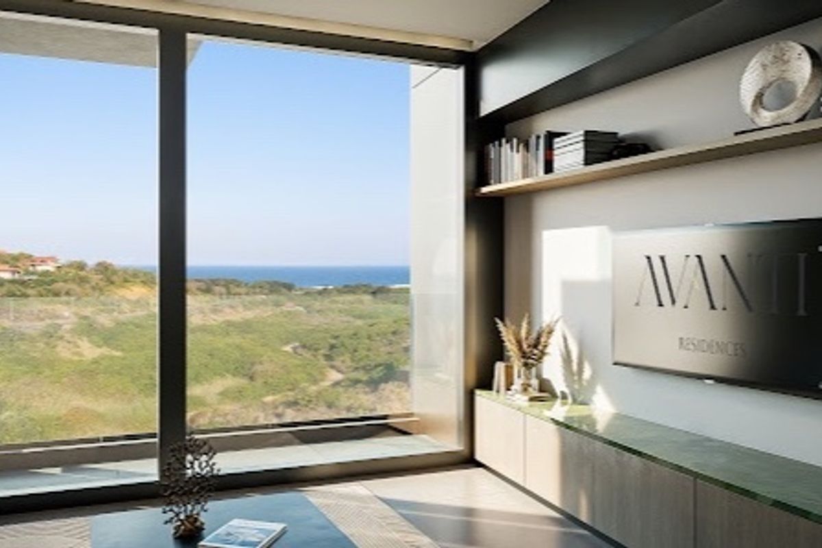 Modern living room featuring floor-to-ceiling windows with scenic coastal views, custom built-in cabinetry, and a sleek floating shelf.