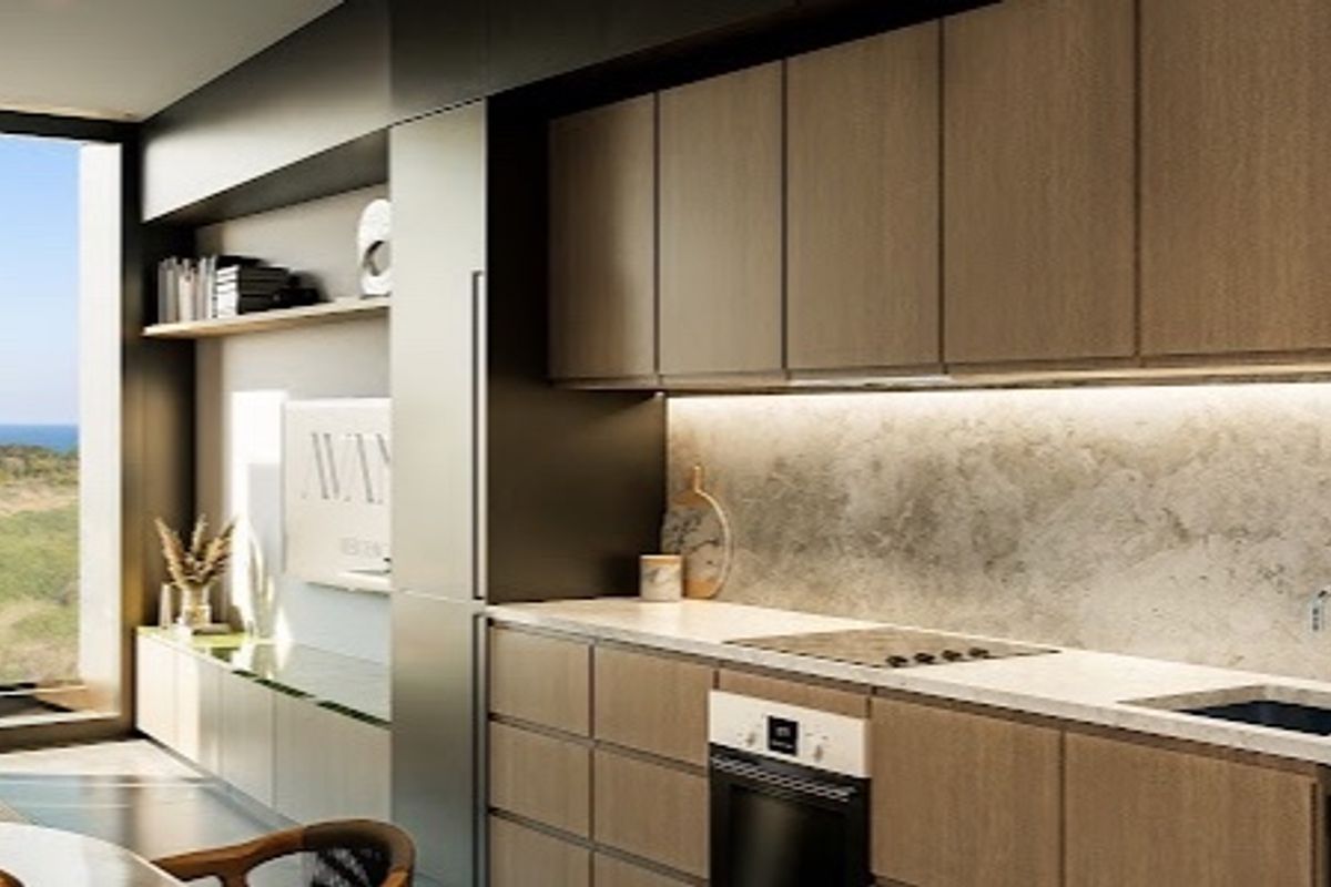 Modern kitchen featuring sleek wood-tone cabinetry, stone countertops, integrated appliances, and under-cabinet lighting, complemented by expansive windows with scenic views.