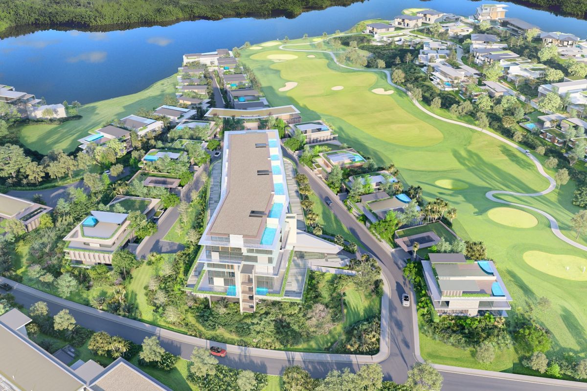 An aerial perspective of the luxury penthouse development, showcasing its integration with the surrounding golf course, waterfront, and landscaped estate grounds.