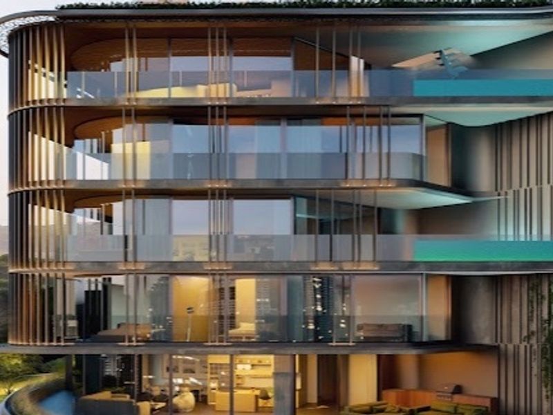 A modern penthouse exterior featuring multi-level private balconies with glass balustrades and sophisticated architectural screening, showcasing a contemporary luxury residential design.