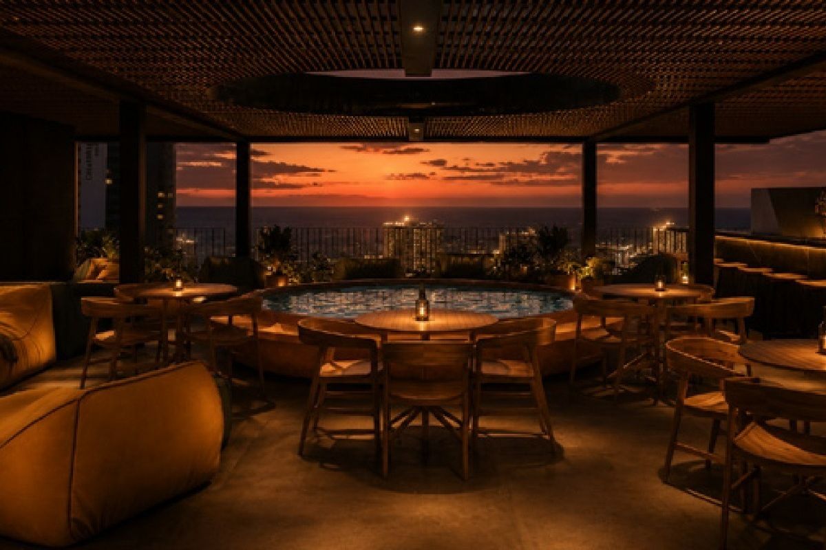 A sophisticated rooftop pool area featuring a built-in pool, slatted timber ceiling, and panoramic sunset views over the city skyline.