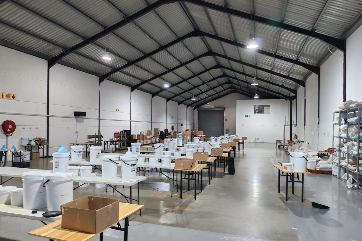 Spacious industrial warehouse featuring a high-clearance steel portal frame, durable epoxy-coated concrete flooring, and a large roller shutter door for efficient access.