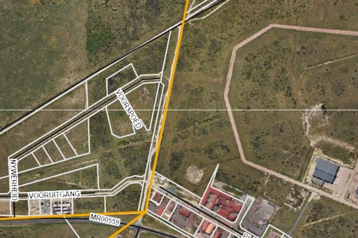 Aerial view of vacant commercial land showing site boundaries, road access, and surrounding infrastructure.