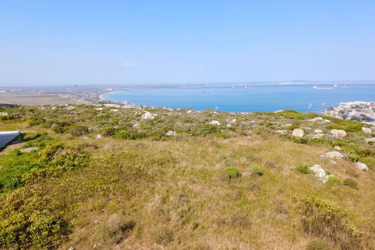 An elevated view overlooking the coastal landscape and bay area, showcasing the natural terrain and surrounding environment.