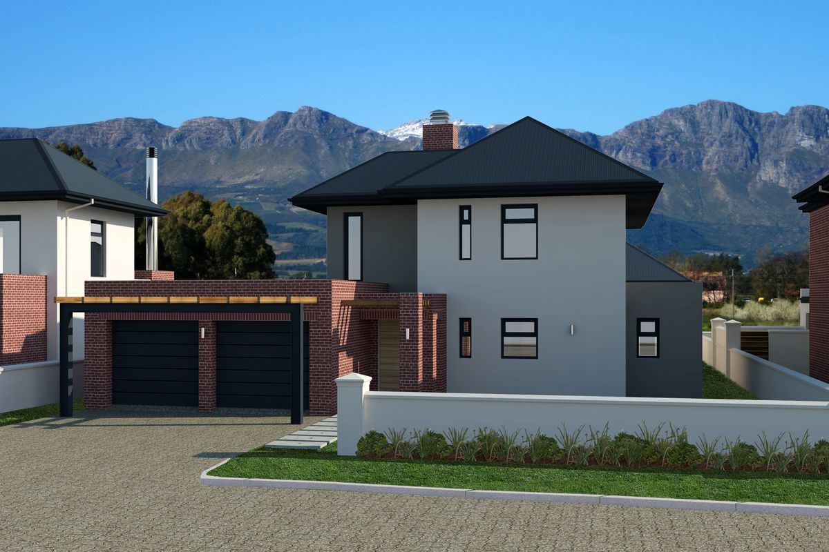 A modern two-story residential property featuring a double garage, brick accents, and a metal roof, set against a scenic mountain backdrop.