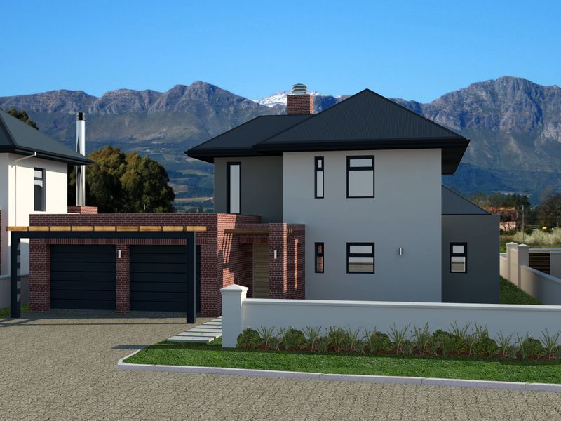A modern two-story residential property featuring a double garage, brick accents, and a metal roof, set against a scenic mountain backdrop.