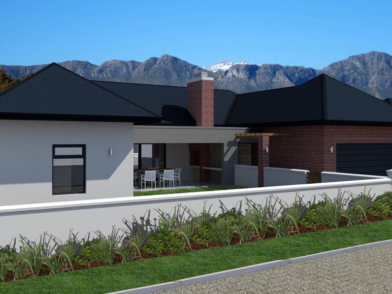 A modern residential property featuring a brick chimney, metal roof, and a covered patio, set against a scenic mountain backdrop.