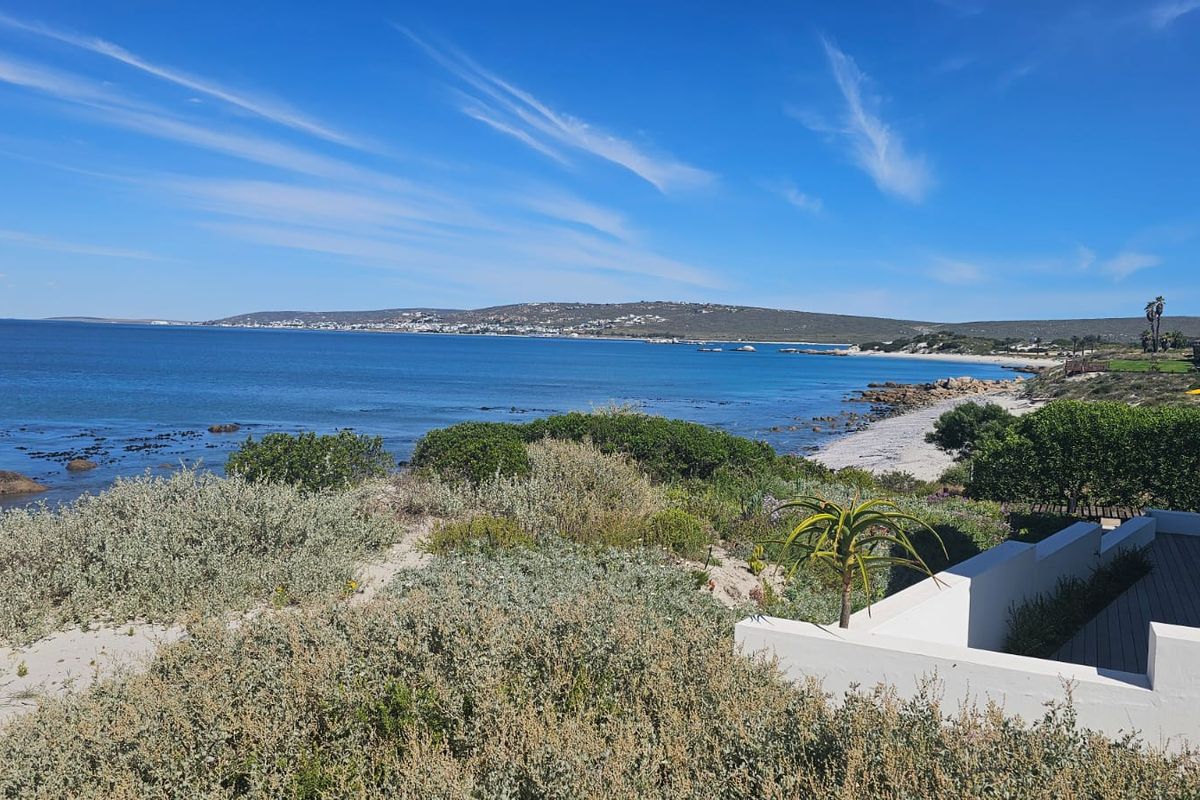 A scenic view of the coastline and ocean from the property, showcasing the natural landscape and beach access.