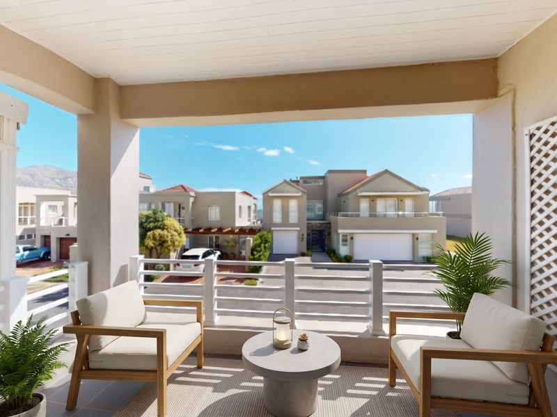 A covered balcony featuring tiled flooring, a protective railing, and a lattice privacy screen, offering an open view of the surrounding residential neighborhood.
