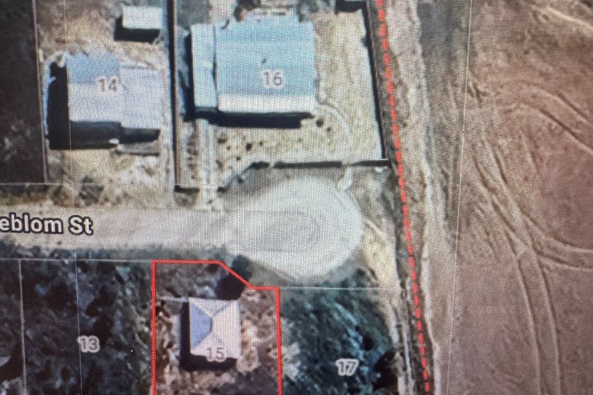 An aerial view showing the property boundary and location of the house on the plot.
