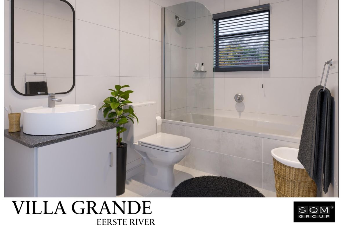 Modern bathroom featuring a vessel sink vanity, toilet, and a bathtub with a glass shower screen and tiled finishes.