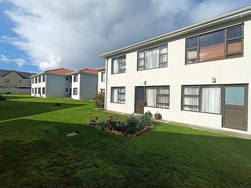 WHY RENT WHEN YOU CAN OWN THIS GROUNDFOOR APARTMENT? - Photo 1