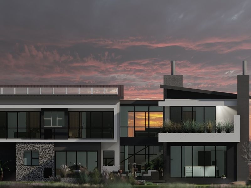 A modern architectural rear elevation featuring stone cladding, expansive glass windows, and a balcony under a dramatic sunset sky.