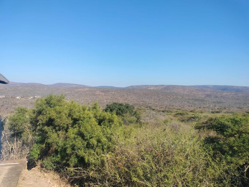 Expansive scenic view overlooking the surrounding natural landscape and rolling hills of the farm property.