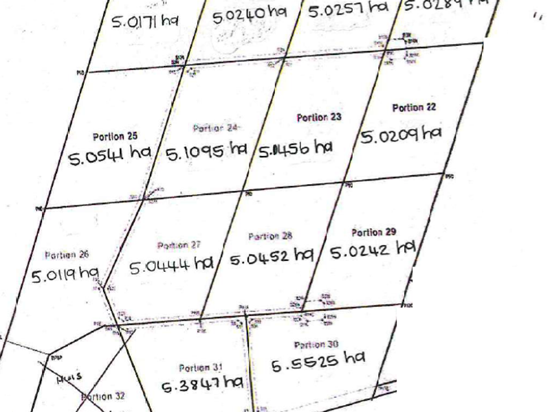 A cadastral survey map showing the subdivision layout and land area measurements for multiple residential portions.