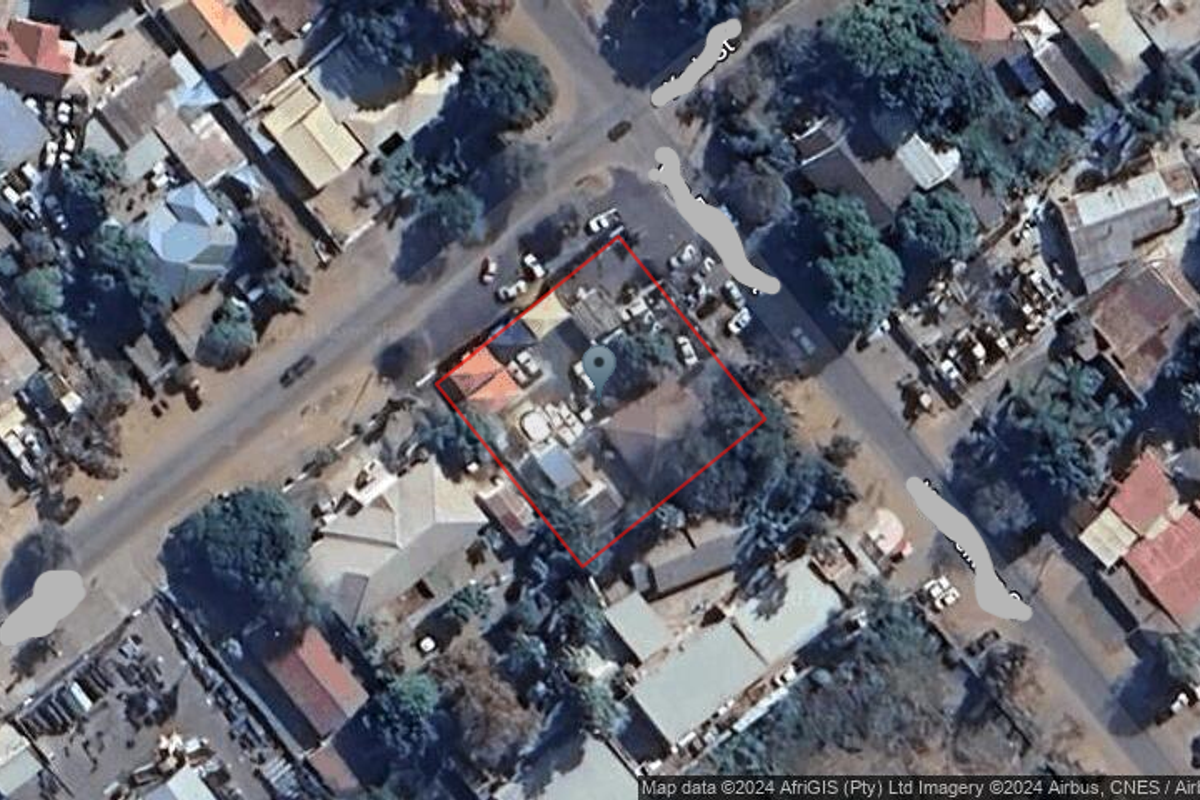 An aerial view of the property location showing the building footprint and surrounding street layout.